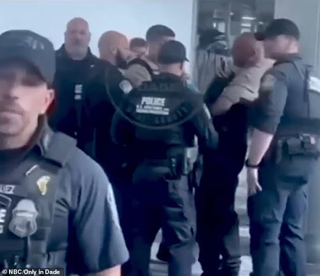 Video captured of the arrest shows White being handcuffed as he was surrounded by at least seven officers