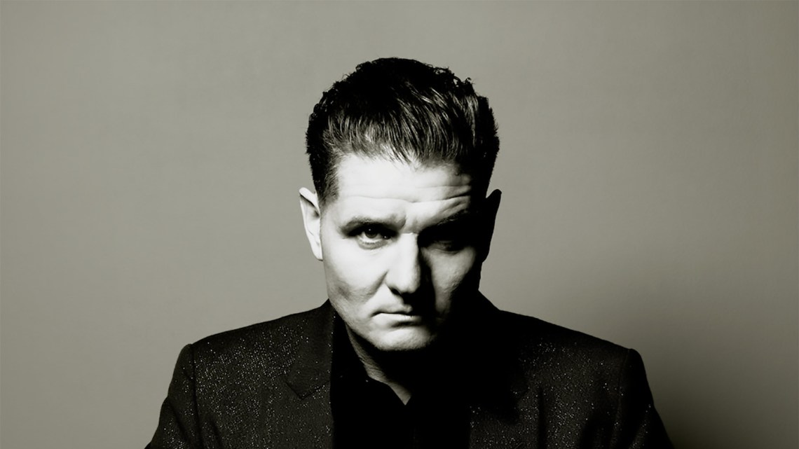 Nitzer Ebb Front man Douglas McCarthy stares intensely at the camera in this back and white portrait 